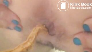 Woman shitting long diarrhea in the bathtub water