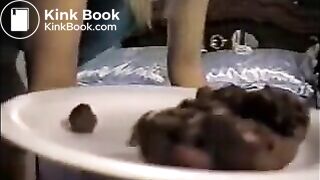 Blonde shitting turd on a plate and pissing on a glass