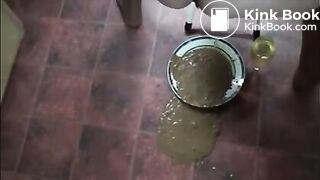 Wife shitting a lot of diarrhea in a white plate and pissing in a glass