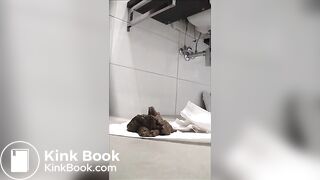 Hot babe in high heels shitting in the bathtub