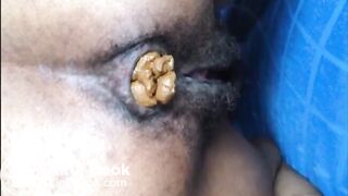 Hairy asshole latina shitting closeup