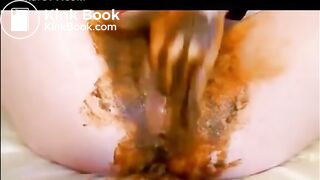 Babe masturbating with dildo while shitting