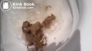 Beautiful blonde shitting in the toilet