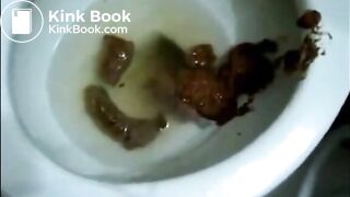 Round butt girl shitting standup in the toilet