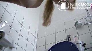 Blonde shitting a long turd in the toilet standing
