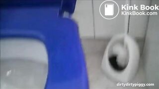 Blonde shitting a long turd in the toilet standing