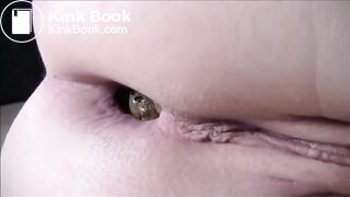 Shaved girl shitting closeup