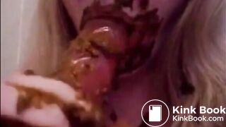 Girl giving blowjob to a dildo full of shit