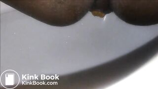 Ebony milf shitting closeup in the toilet