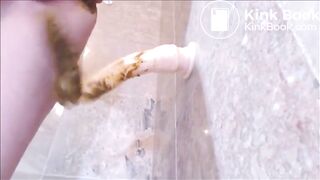 Dirty girl playing with shitty dildo in the bathroom