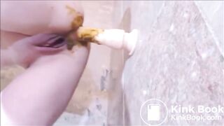 Dirty girl playing with shitty dildo in the bathroom
