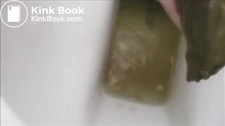 Girl shitting an hard turd in the toilet