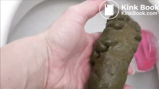 Girl shitting an hard turd in the toilet