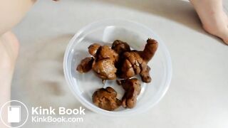 Blonde pushes hard rocks into a lunch box