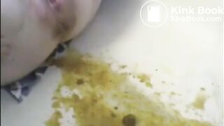 Woman shitting liquid after enema