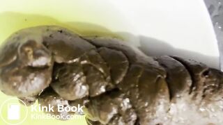 Blonde masturbates while pushing out a huge turd