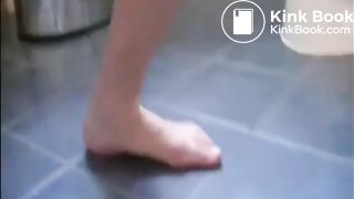Shaved pussy girl shitting a big turd on the bathroom floor