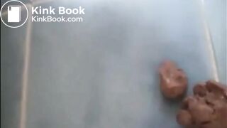 Shaved pussy girl shitting a big turd on the bathroom floor