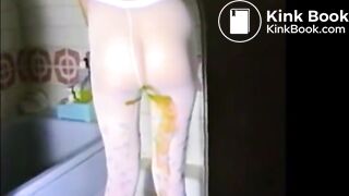 Woman shitting liquid poo on white pantyhose