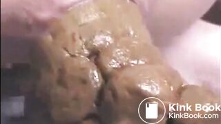 This woman is shitting a huge turd closeup