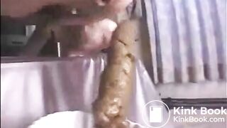 This woman is shitting a huge turd closeup