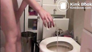 Skinny blonde girl shitting in a glass