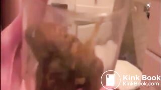 Skinny blonde girl shitting in a glass