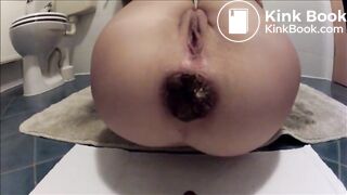 Woman shitting a very large turd