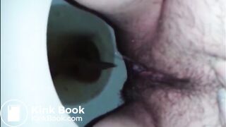 Hairy woman shit and piss in the toilet closeup