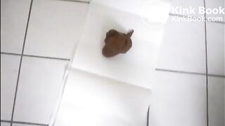 Mature brunette shitting on the bathroom floor standing up