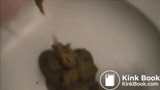 Girl shitting a lot close up in the toilet
