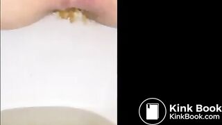 Girl shitting long turd closeup