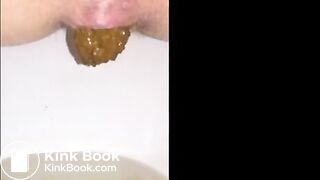 Girl shitting long turd closeup