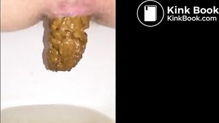 Girl shitting long turd closeup