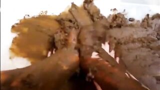 Girl shitting and smearing on feet