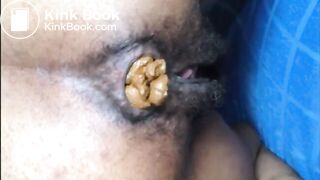 Hairy asshole ebony shitting closeup
