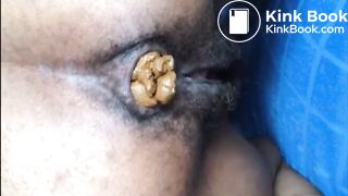 Hairy asshole ebony shitting closeup