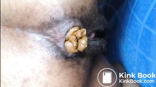 Hairy asshole ebony shitting closeup