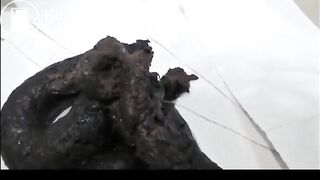 Sexy brunette in high heels and lingerie open wide legs and shitting on the floor