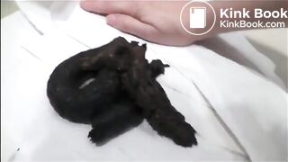 Sexy brunette in high heels and lingerie open wide legs and shitting on the floor