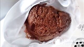 Babe is shitting a very big quantity of shit on white panty
