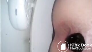 Girl shitting in the toilet closeup