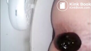 Girl shitting in the toilet closeup