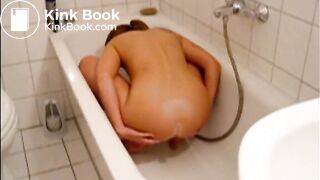 Girl enema in the bathtub and shitting