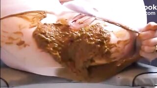 Woman shitting a lot of diarrhea on pantyhose
