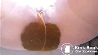 Woman shitting a lot of diarrhea on pantyhose