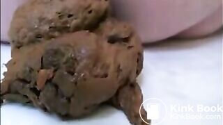 Blonde milf in high heels shitting on the floor