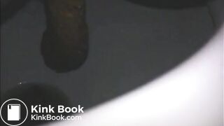 Woman shitting a long turd very slowly in the toilet