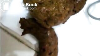 Brunette shitting and eating her own shit