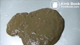 Brunette pissing and shitting on a car outdoor